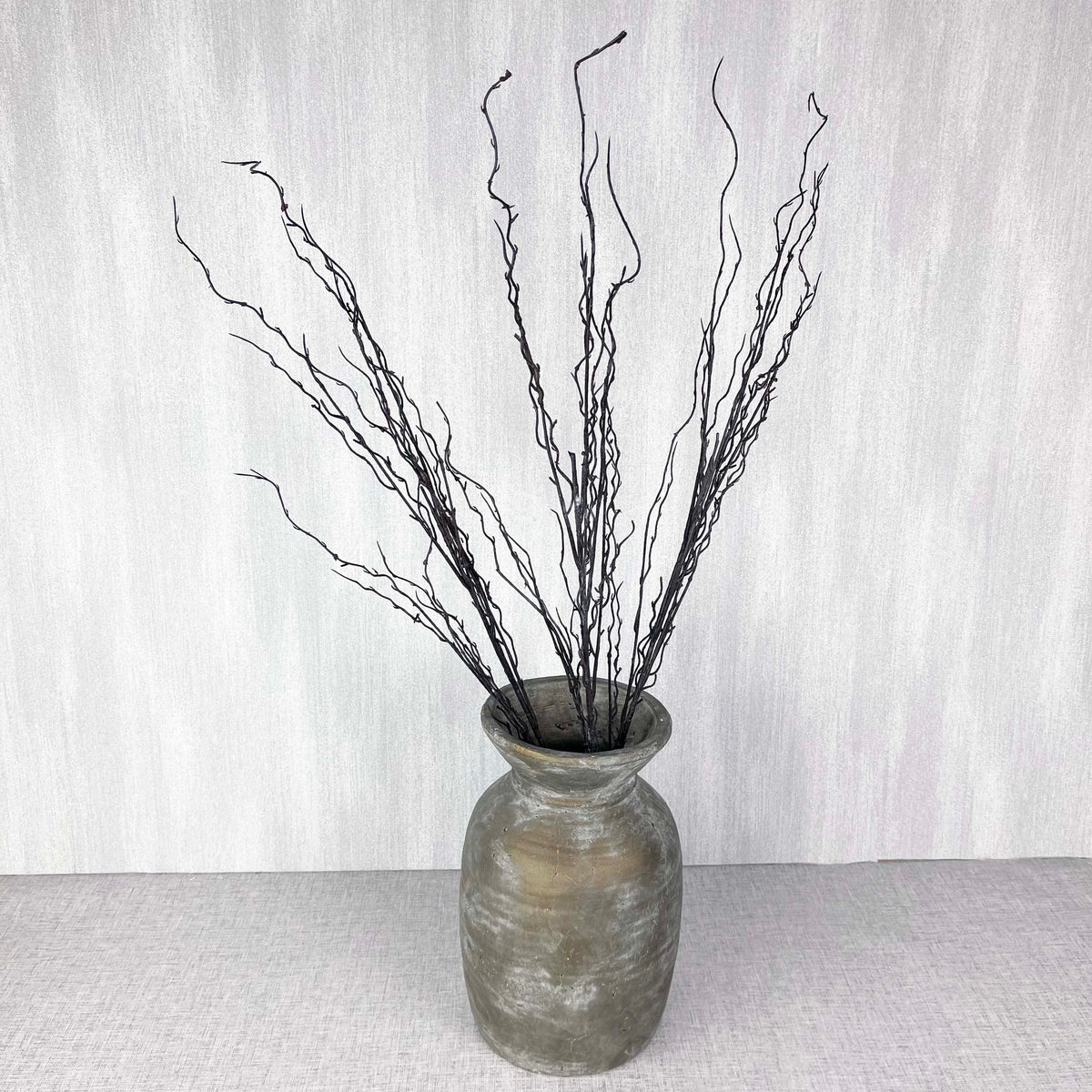 Branch spray in antique gold vase