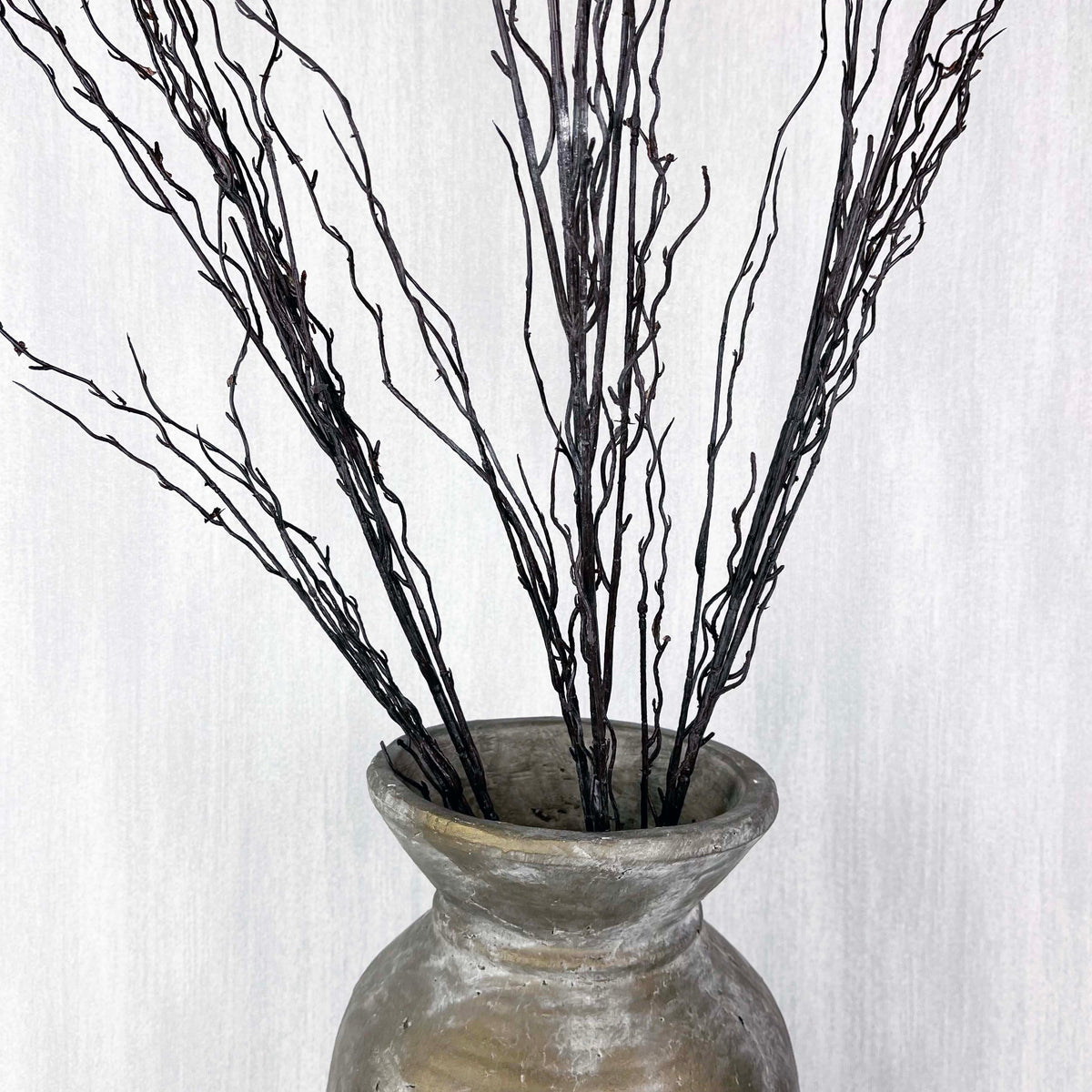 Branch spray close up in antique gold vase