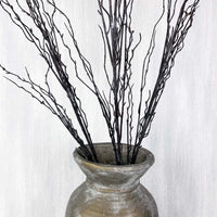 Branch spray close up in antique gold vase