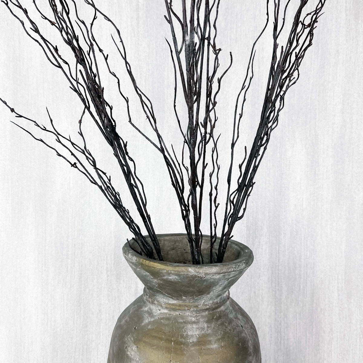 Branch spray close up in antique gold vase