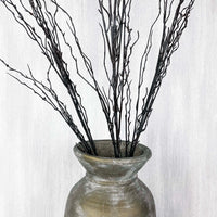 Branch spray close up in antique gold vase