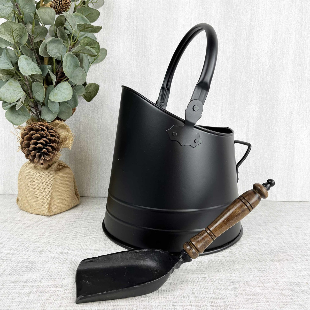 Black Coal Bucket with Teak Handle Shovel with autumn leafy tree, on white background