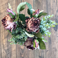 Dusty Pink Spray Rose Peony on a wood background.