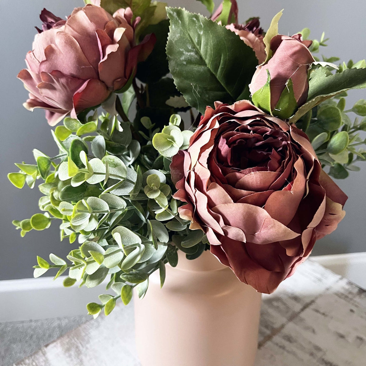 Dusty Pink Spray Rose Peony with leafy spray in pink vase.