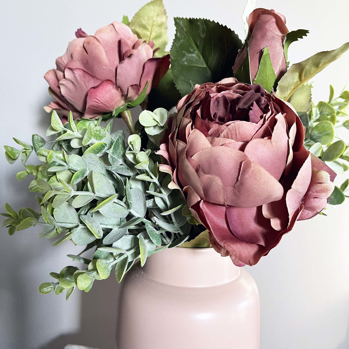 Dusty Pink Spray Rose Peony with leafy spray in pink vase.