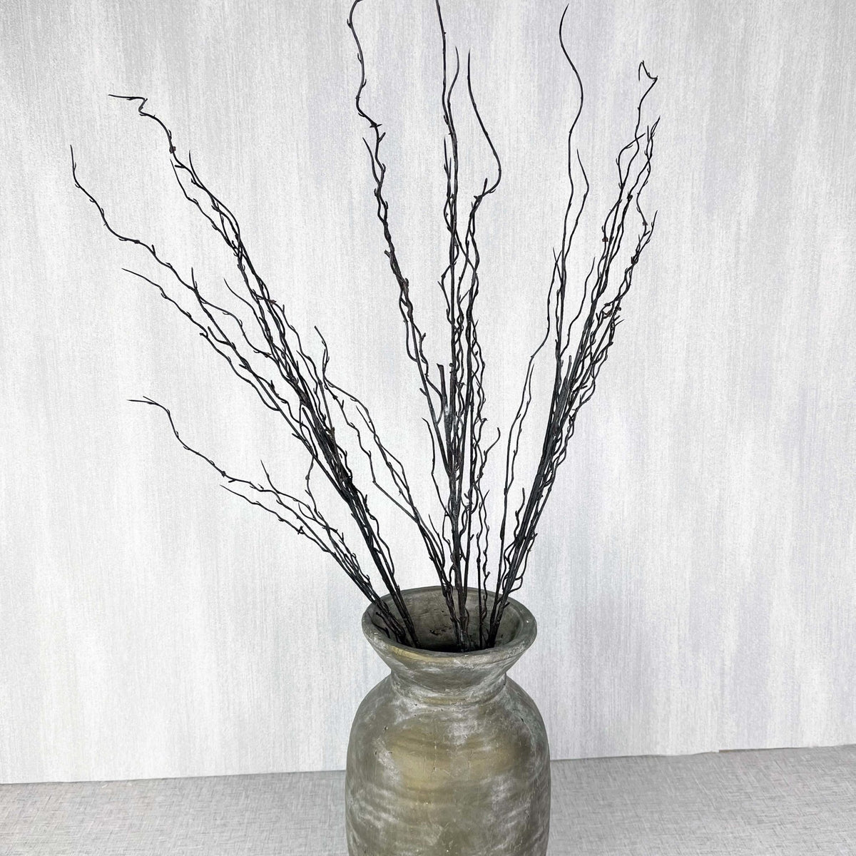 Branch spray in antique gold vase