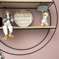 Happy Rainy Ducks ornament sat next to wooden sign saying this is our happy place and another friendly duck.