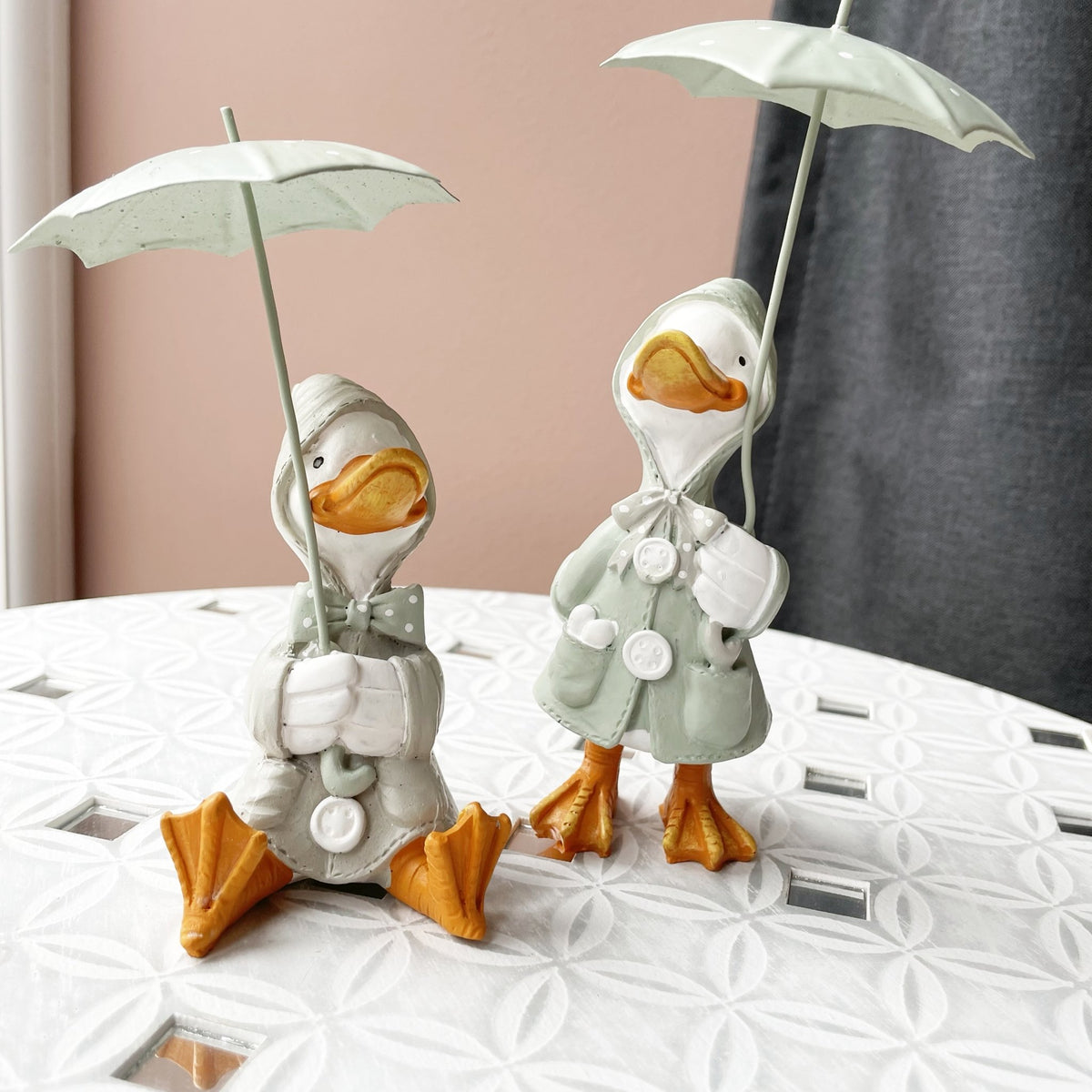 Happy Rainy Ducks ornament set of 2 on table