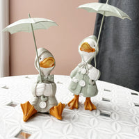 Happy Rainy Ducks ornament set of 2 on table