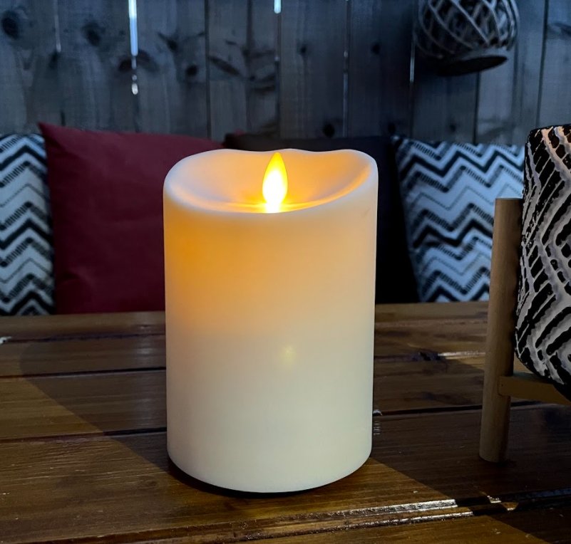 Luminara Outdoor Flameless Battery Candle Lit up at night