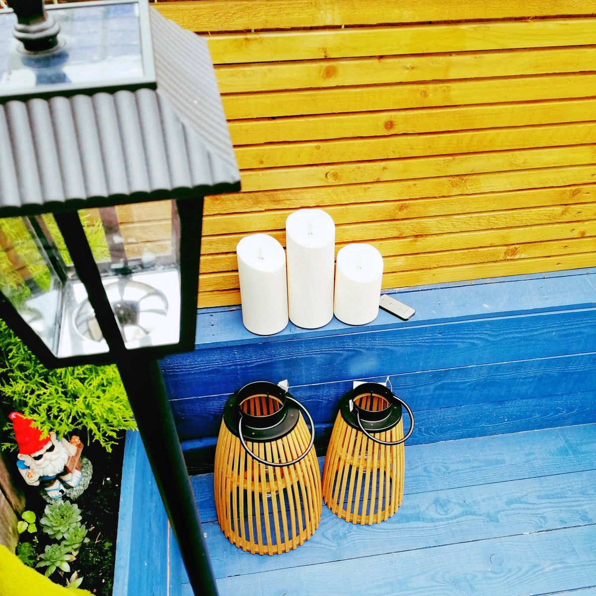 Luminara Outdoor Flameless Battery Candles with lantern and solar lamp post light, top view