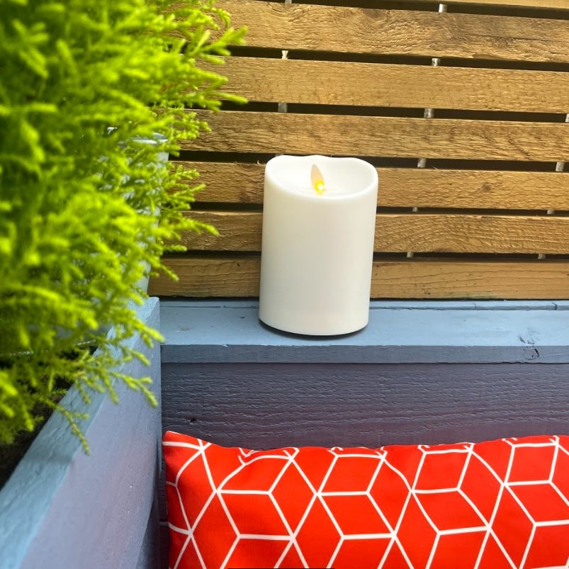 Luminara Outdoor Flameless Battery Candle on decking area