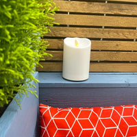 Luminara Outdoor Flameless Battery Candle on decking area