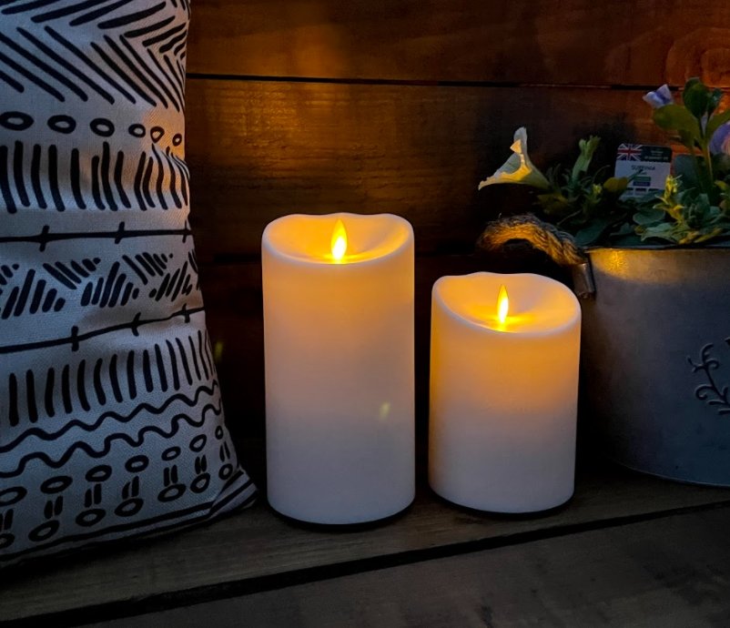 Luminara Outdoor Flameless Battery Candles lit up at night