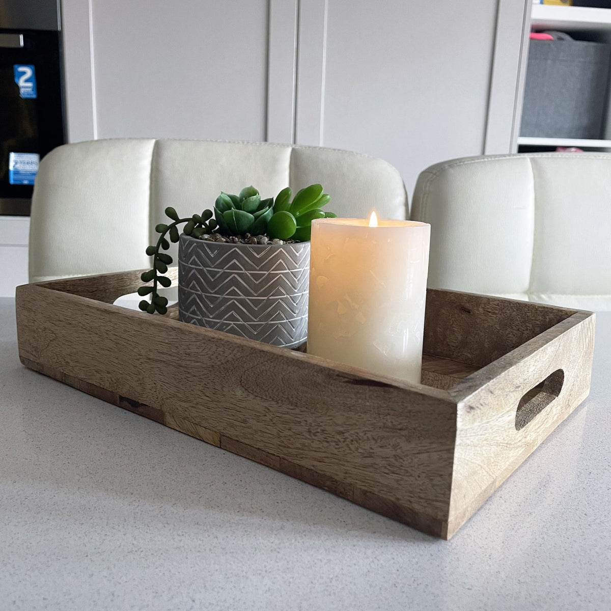Rectangular Herringbone Wooden Serving Tray small on a kitchen bench with a planter and lit candle