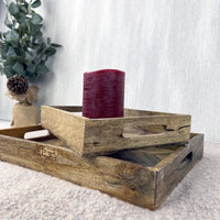 Rectangular Herringbone Wooden Serving Trays with red flameless candle on white background