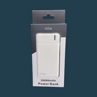 A white power bank in its retail packaging, labeled '20000mAh Power Bank' set against a dark teal background.