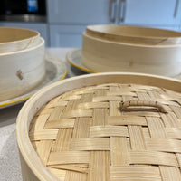 Two-Tier Bamboo Steamer on plates, close up