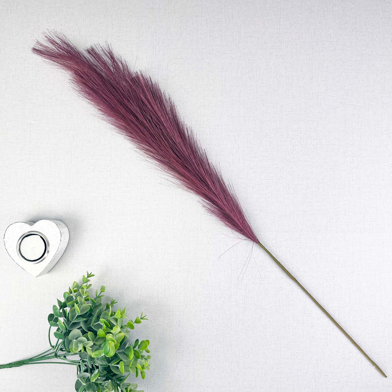 Scarlet Red Faux Pampas Grass Stem with a heart tealight holder and greenery, on a white background.