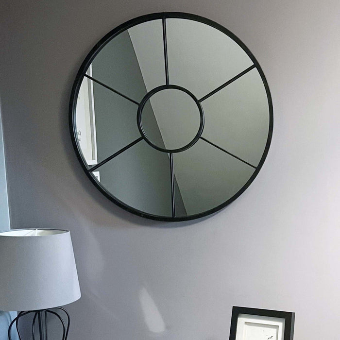Aperta Iron Round Window Style Mirror Black on landing with lamp and photo frame