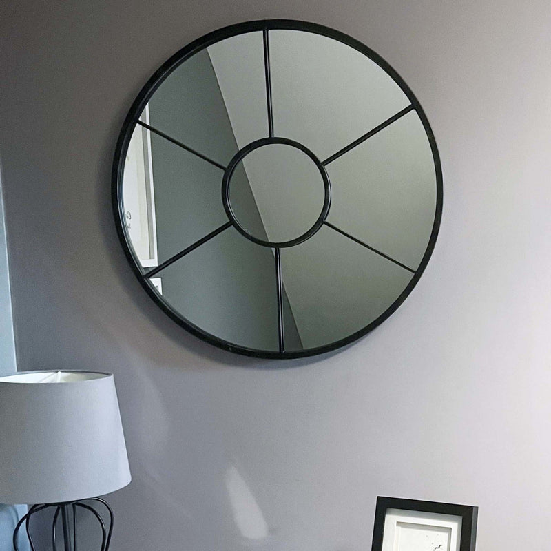 Aperta Iron Round Window Style Mirror Black on landing with lamp and photo frame
