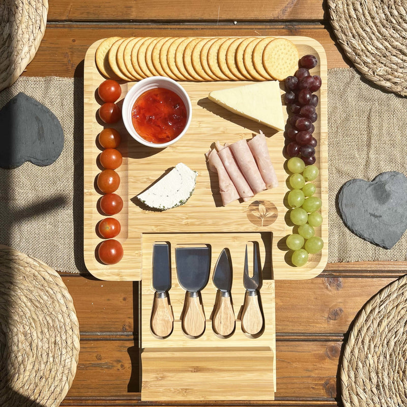 Bamboo Cheese Board & Cheese Knife Set on wooden garden dining table