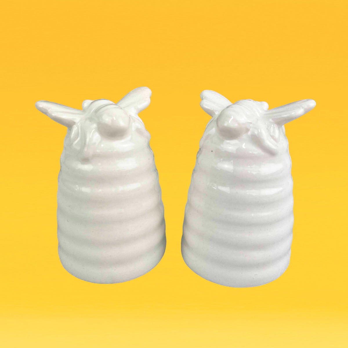 https://cherishhome.co.uk/cdn/shop/products/cream-bee-hive-salt-pepper-shaker-set-584982.jpg?v=1695491543&width=1200