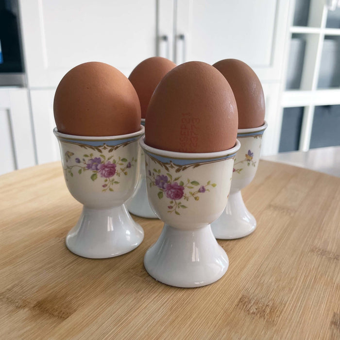 Darcey Egg Cup Set on wood chopping board, close up
