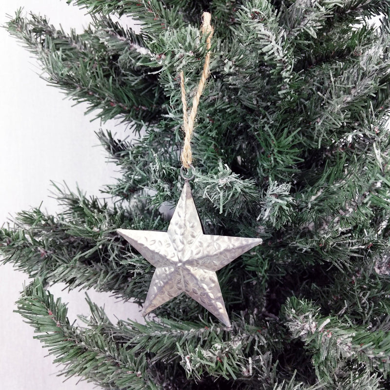 Decorative Metal Hanging Star on Christmas Tree