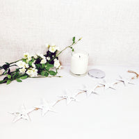 Decorative white hanging stars  with candle