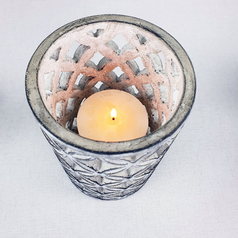 Geometric Stone Candle Holder with candle lit