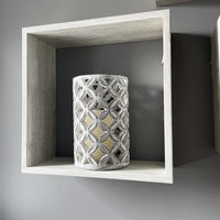 Geometric Stone Candle Holder on grey shelf
