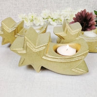 Set of three gold star tea light candle holders