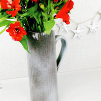 Gradus Ceramic Grey Jug close up with red flowers