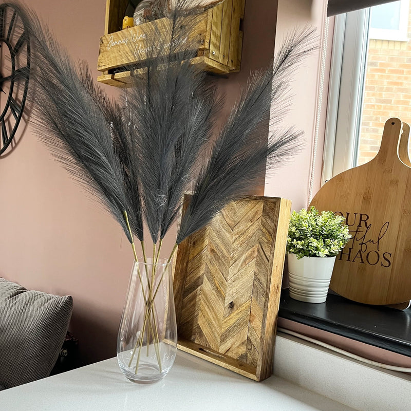 Grey Faux Pampas Grass Stems in glass vase in Sulking room pink room.