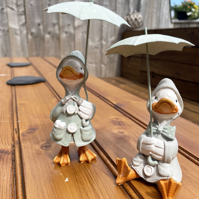 Happy Rainy Ducks ornament set of 2 sat on table