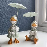 Happy Rainy Ducks ornament set of 2 sat on windowsill