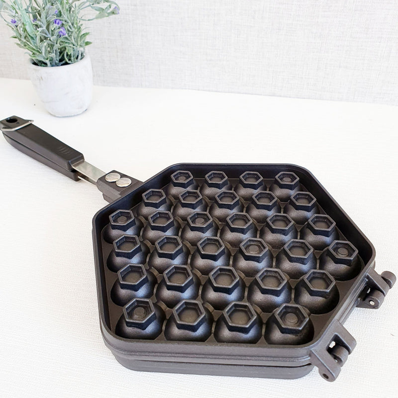 Hexagonal Waffle Maker on white table with plant