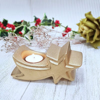 Holly Berry and close christmas tea lights in a shooting star tea light holder