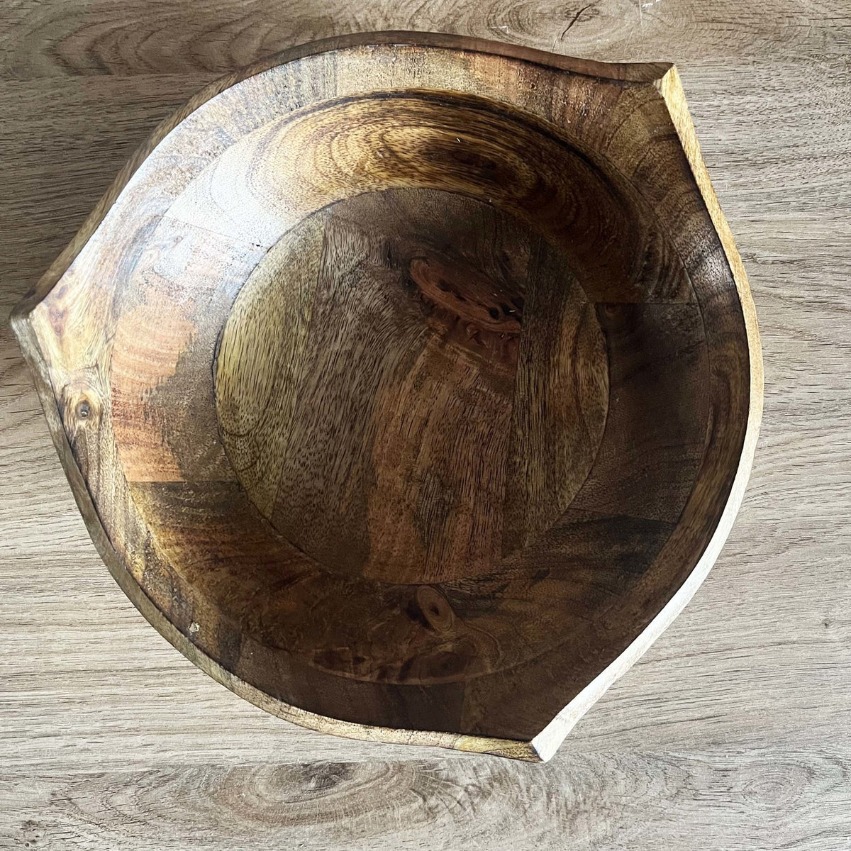 Large Puncta Mango Wood Bowl on wooden table