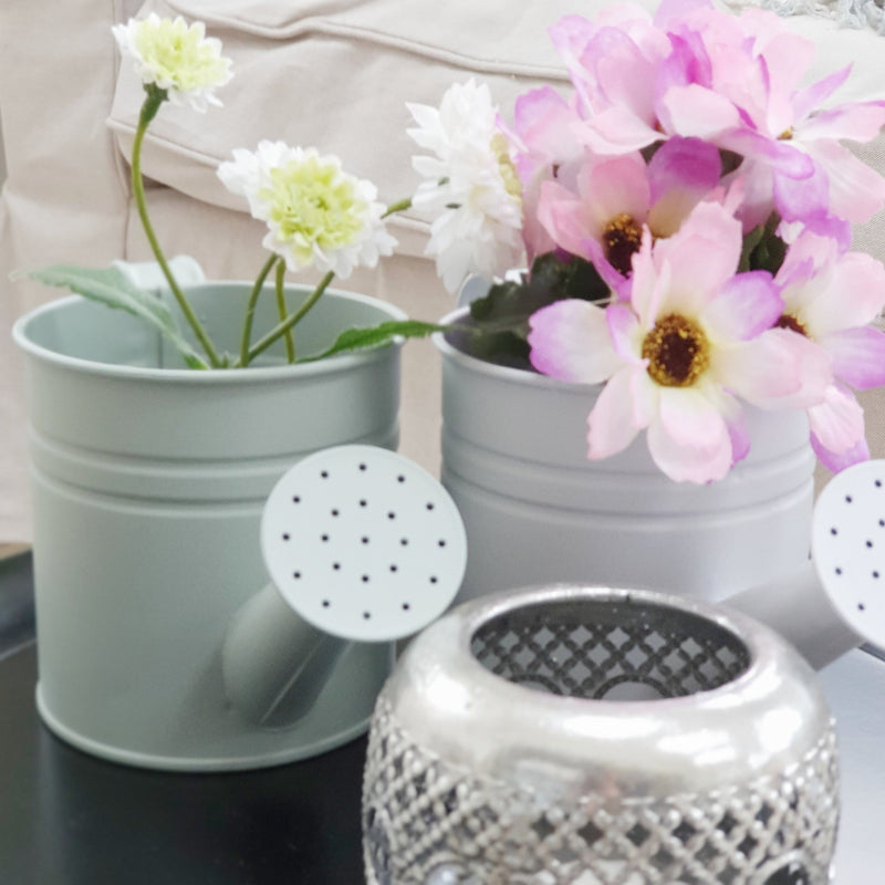 Mini Watering Can Planters close up with tea light holder
