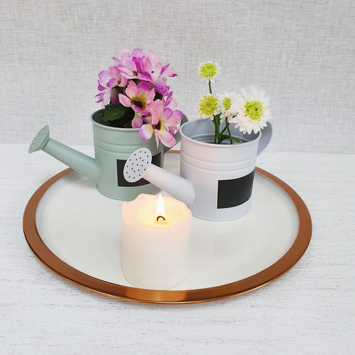 Mini Watering Can Planters on copper tray with candle