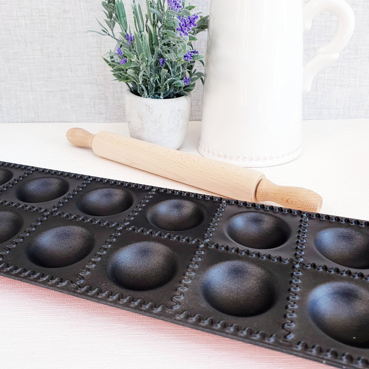 Ravioli Cutting Tray with 12 ravioli square sections and rolling pin and lavendar plant
