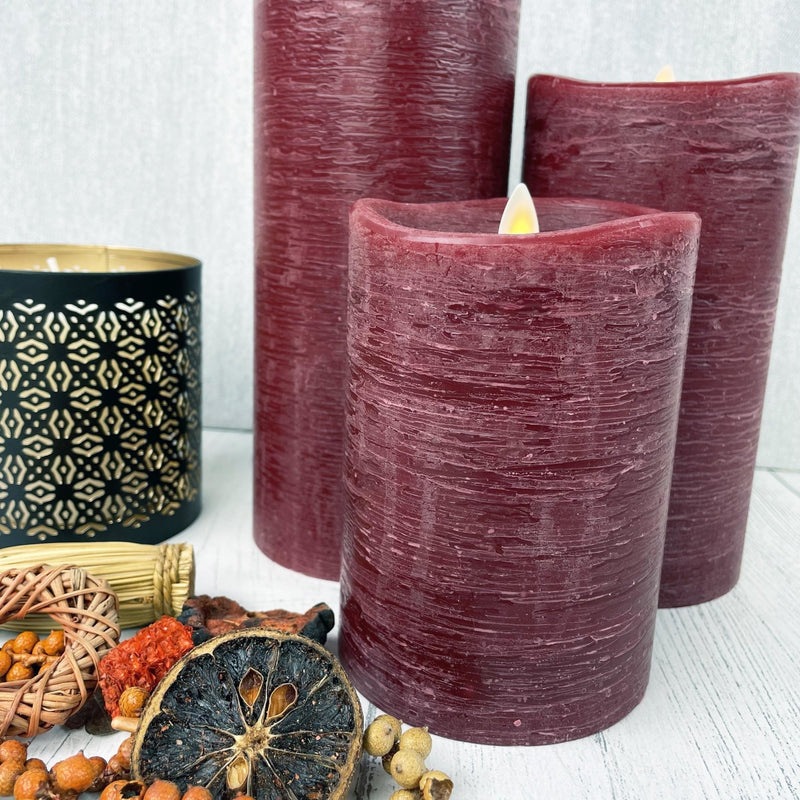 Red Luminara Flame Effect Battery candles close up with autumn details
