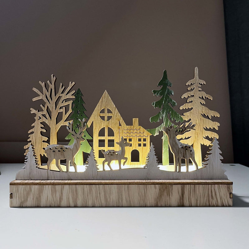 Reindeer & Trees LED Scene Decoration lit up on shelving