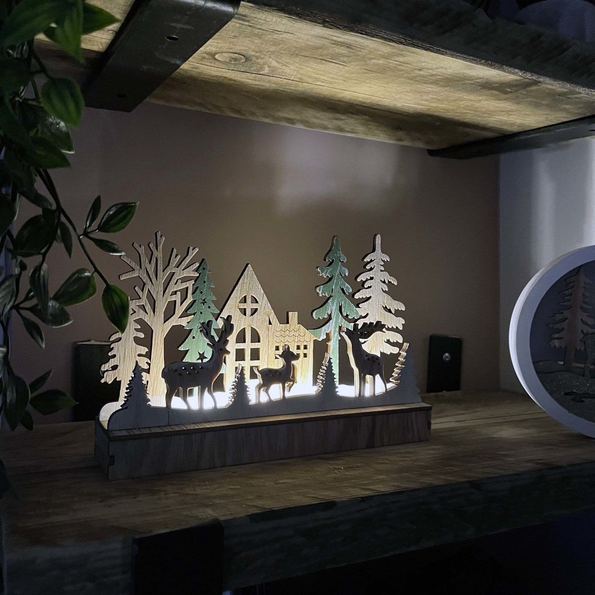 Reindeer & Trees LED Scene Decoration lit up on kitchen shelving