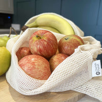 Reusable, Natural, Washable Drawstring Cotton Bags close up of apples in the bag