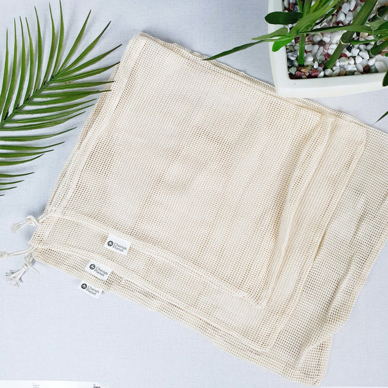 Reusable, Natural, Washable Drawstring Cotton Bags on a white background