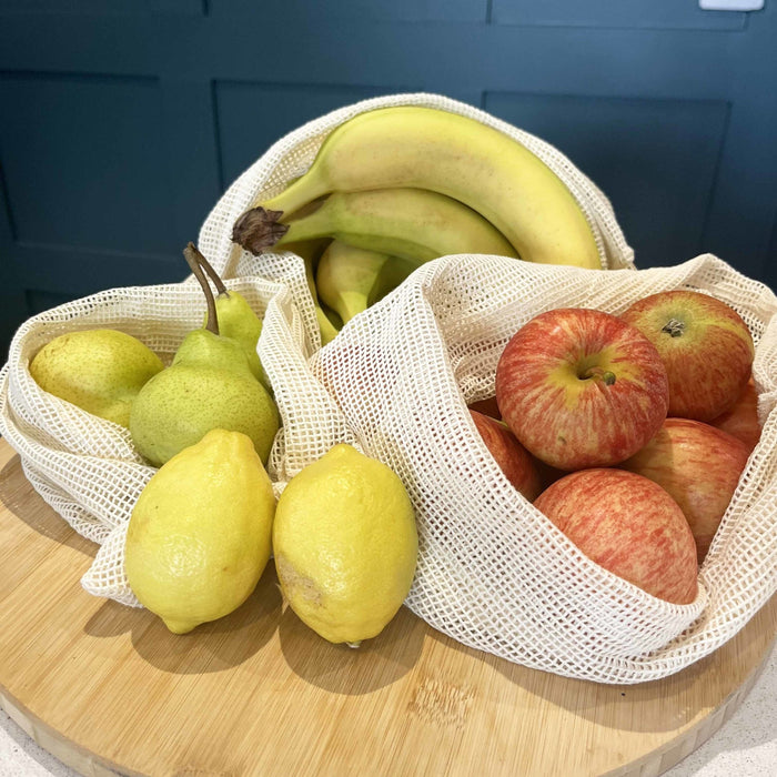 Reusable, Natural, Washable Drawstring Cotton Bags with Apples, bananas, lemons and pears.