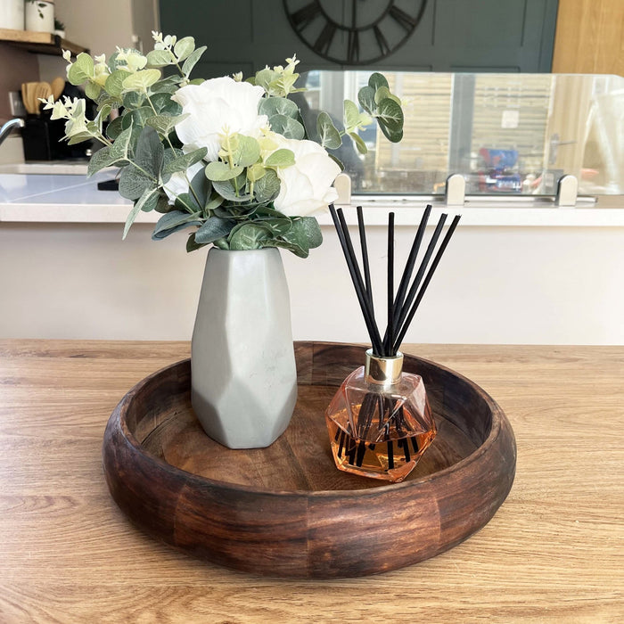 Rich Mango Wood Tray on dining table with vase and reed diffuser.